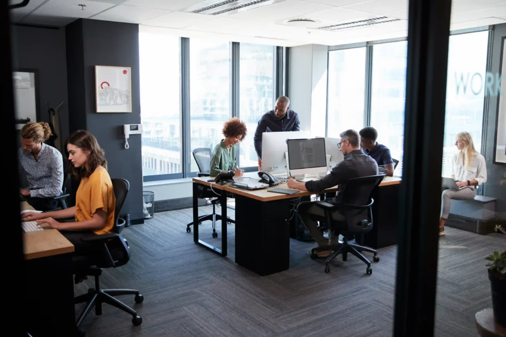 Digital team executing a Technical SEO audit in a modern office.