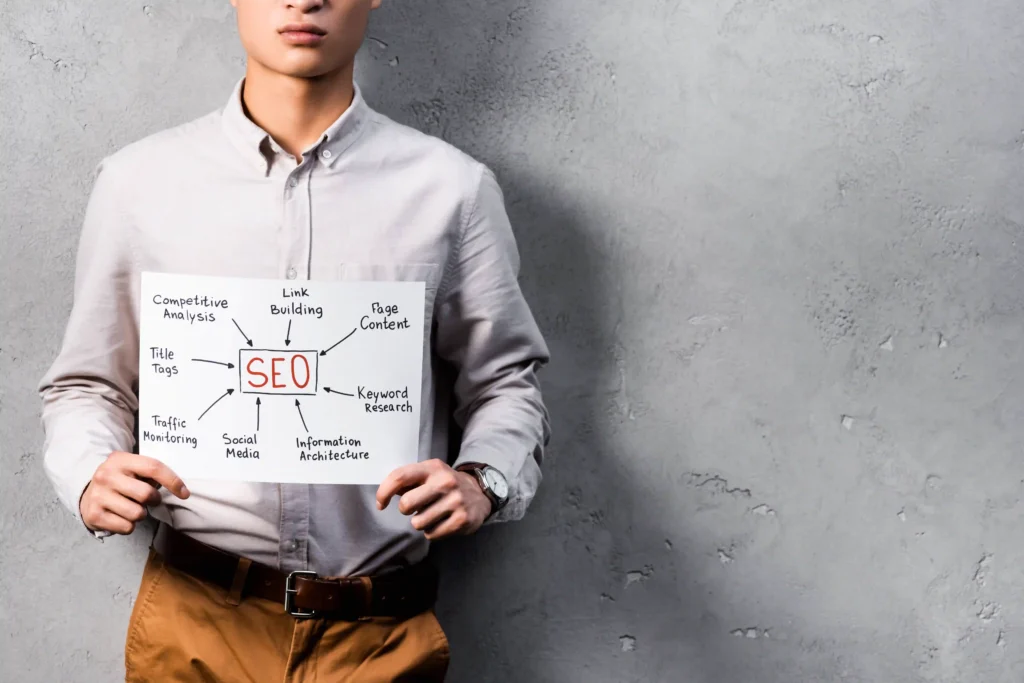 Professional holding a technical SEO roadmap sketch showing SEO elements like link building and keyword research