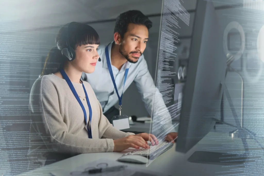SEO specialists reviewing website code for technical SEO importance in a professional setting