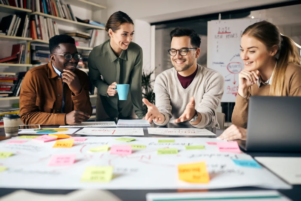 Marketing team planning a technical SEO roadmap with sticky notes and charts on a desk