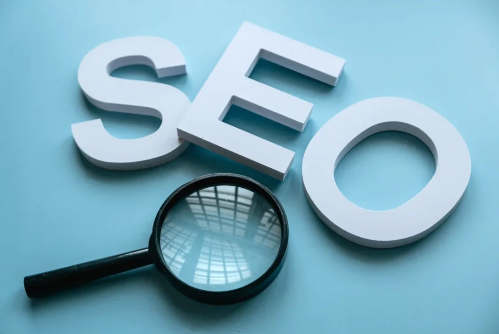 Magnifying glass and SEO letters symbolizing search visibility in Yoast technical SEO strategies