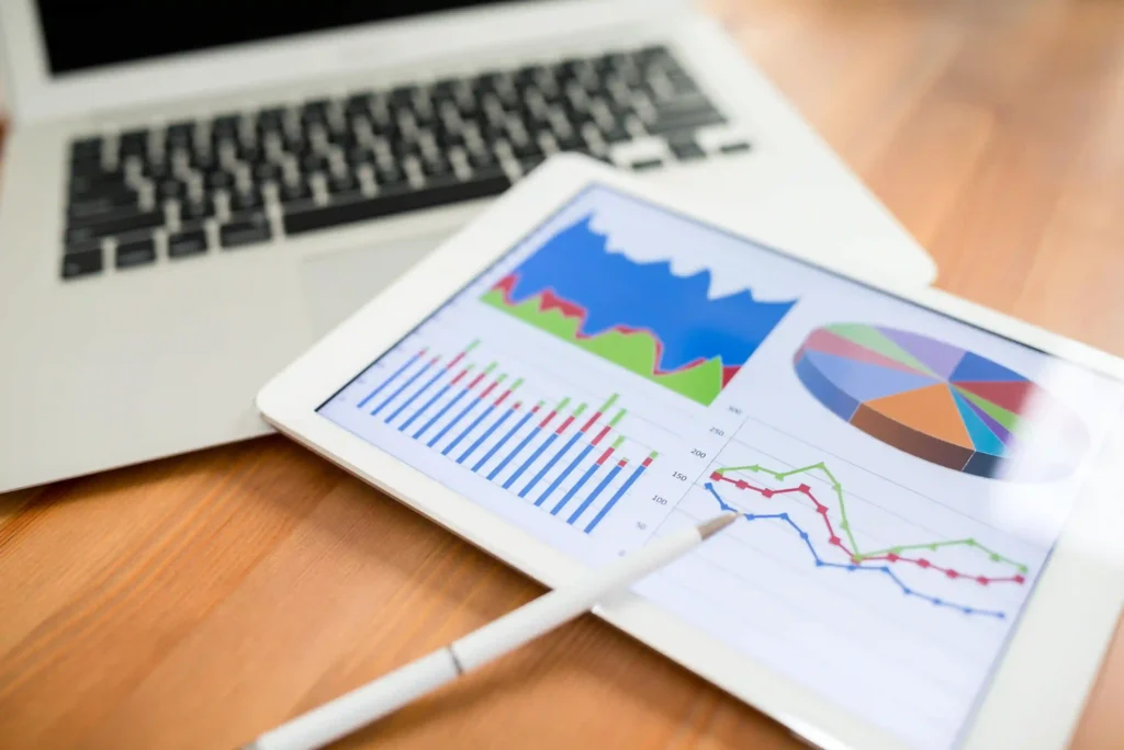 Tablet displaying charts and graphs for traffic analysis using on page SEO recommendations