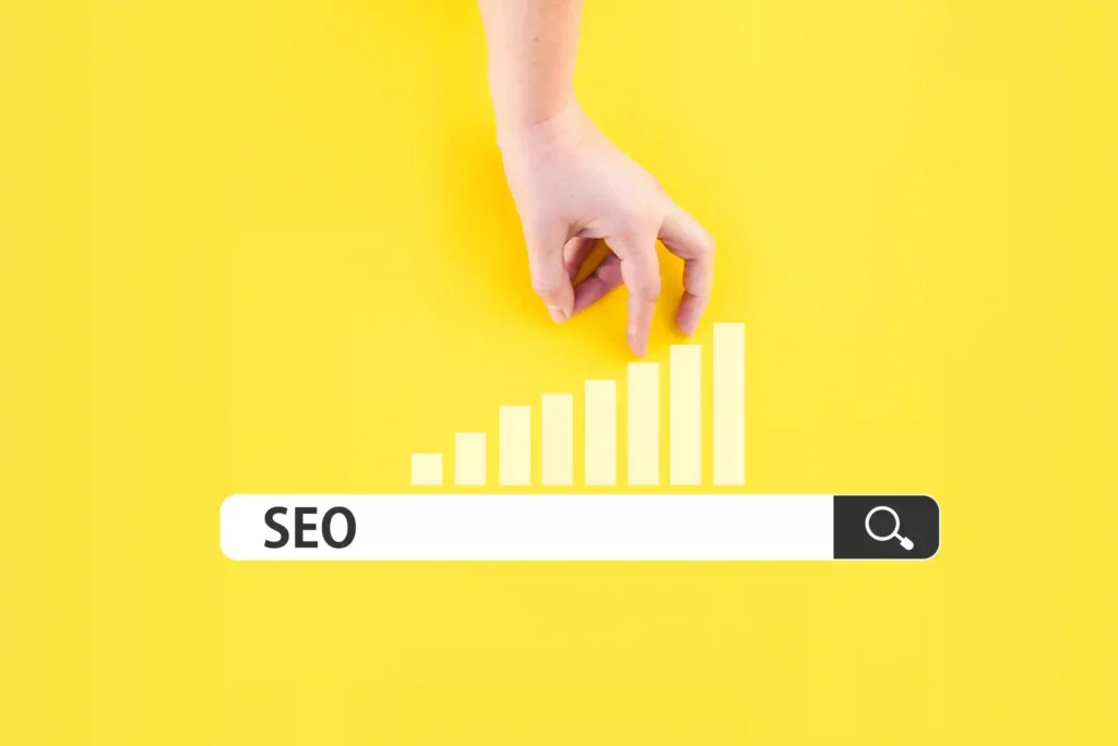Hand climbing a bar chart above seo tech news search bar on yellow background