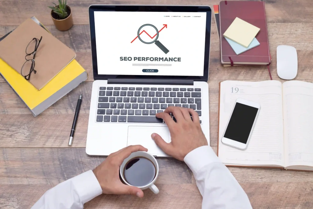 Top-down view of a person working on SEO performance analysis with coffee and planner — hands-on on page seo learning.