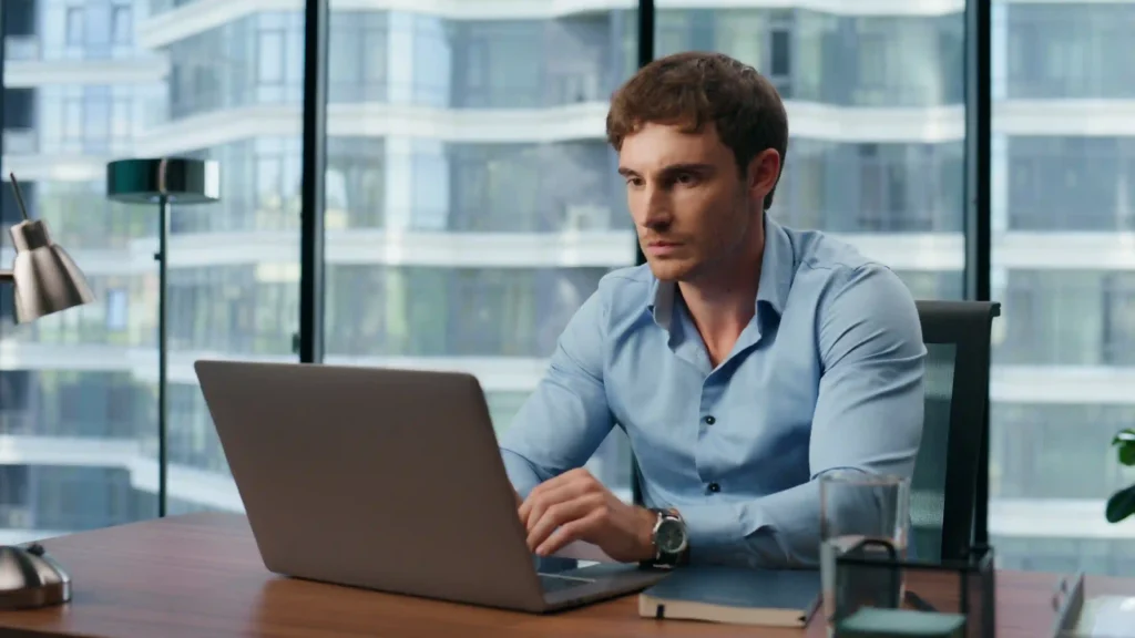 Digital marketing professional analyzing technical SEO local search performance on laptop.