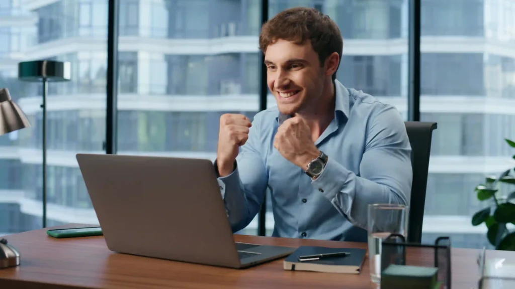 Excited business owner seeing results from technical SEO benefits