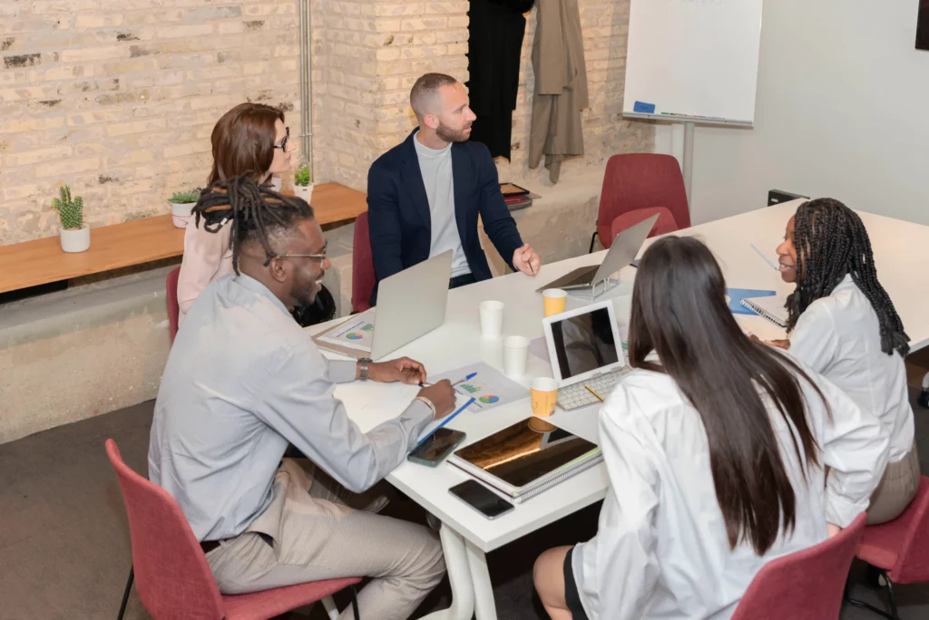 A diverse team of marketers brainstorming ideas for crafting the best SEO company title