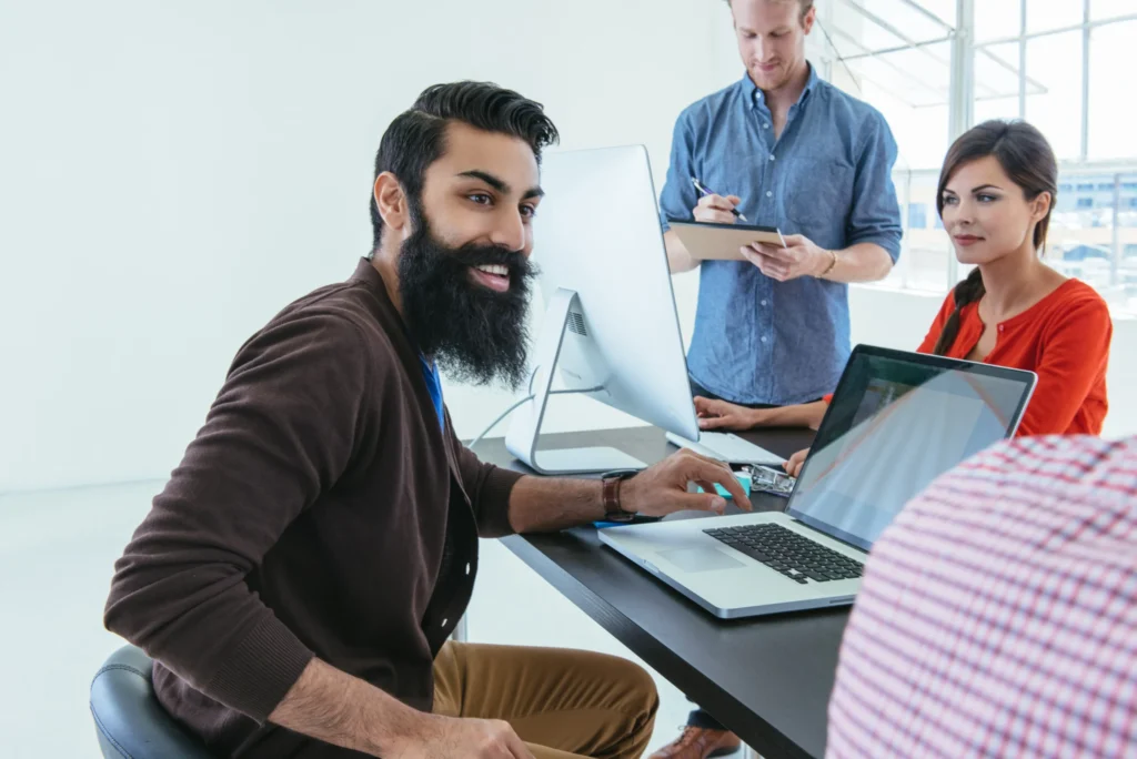 Team of SEO link building specialists collaborating in a modern office environment