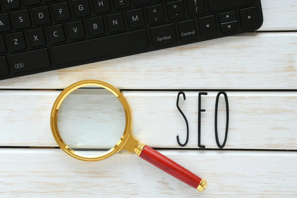 SEO link building specialist tools concept with magnifying glass and keyboard