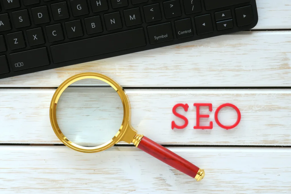 Magnifying glass beside SEO text symbolizing research and planning for internal link building in SEO