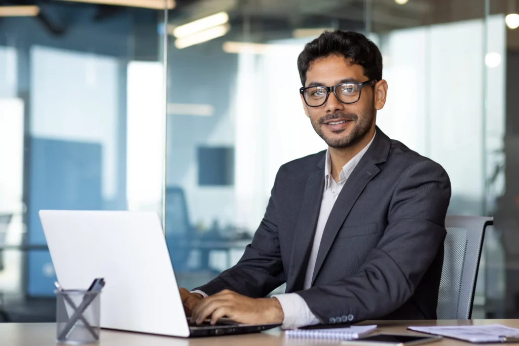 Confident SEO manager working on optimization tasks from a modern office