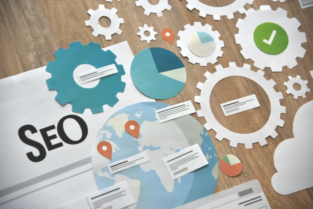 Paper cutouts of SEO gears and analytics visuals illustrating a global seo strategy full form for digital marketing.