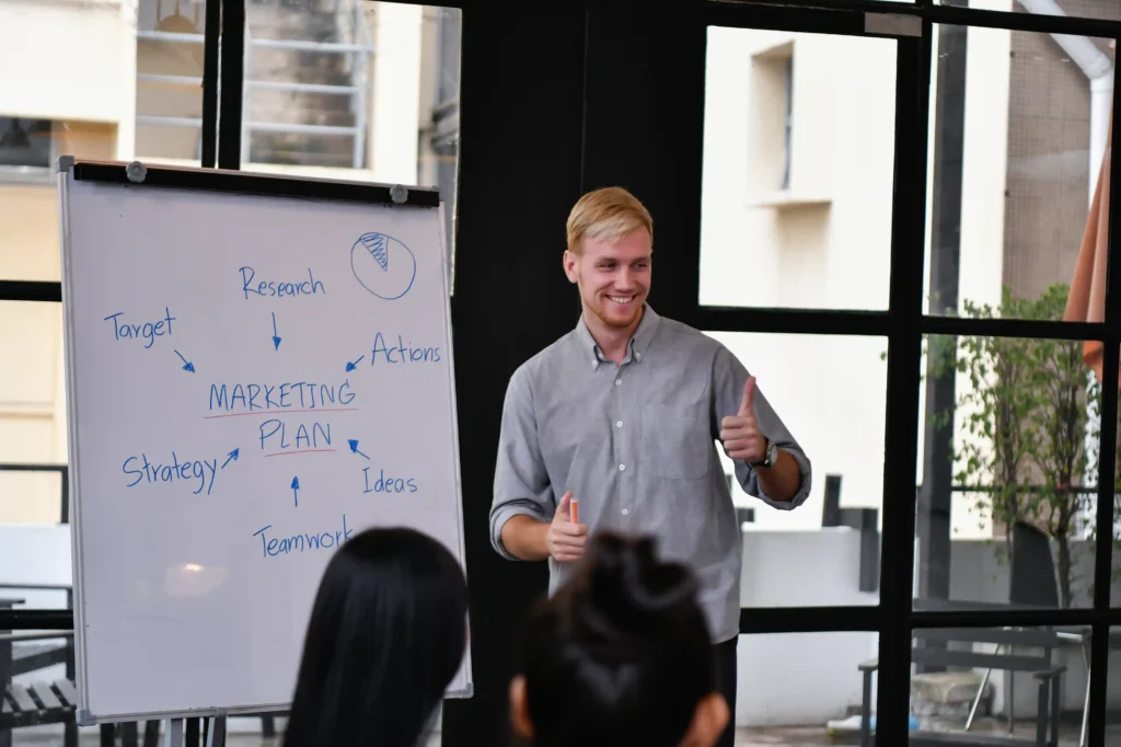 A marketing professional presenting a local marketing plan to a team, illustrating the work of a local search marketing expert.