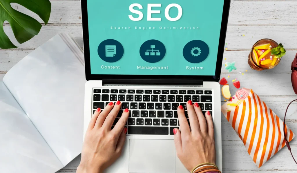 Laptop screen with SEO icons for content, management, and system — modern approach of the best agency for local SEO.