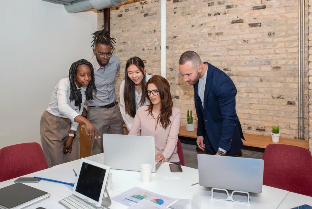 A diverse marketing team planning an enterprise local SEO strategy together in a modern office.