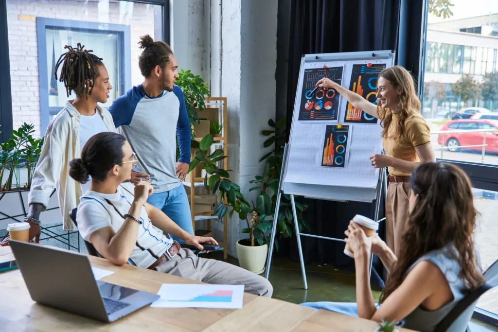 A marketing team reviews charts and campaign data during a strategy meeting, illustrating collaboration at top performance marketing agencies.