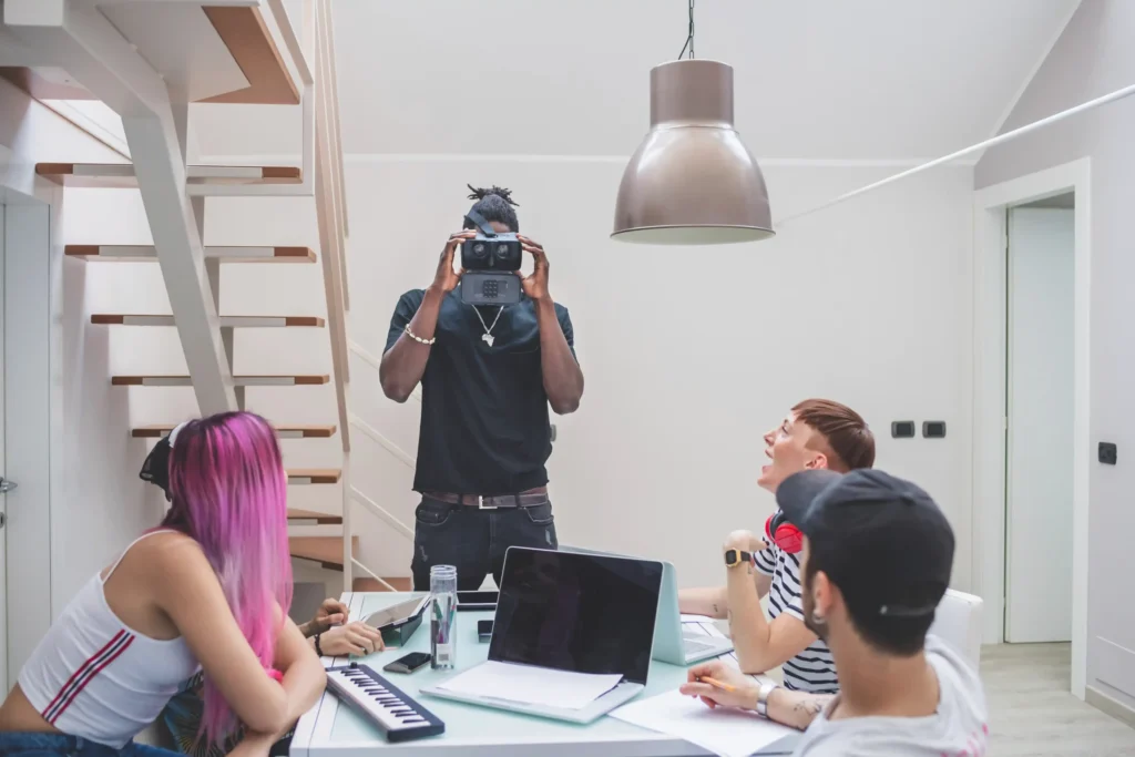 A creative team collaborates during a photoshoot planning meeting, representing the hands-on work of a boutique social media agency.