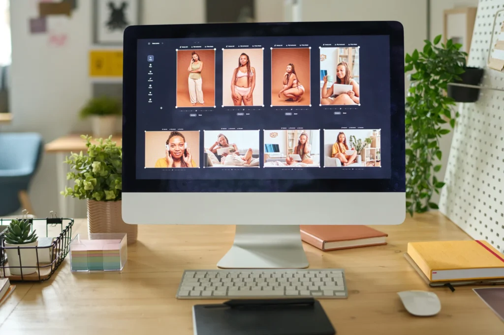 Desktop computer displaying visual assets and media organization used to create content for an online marketing website.