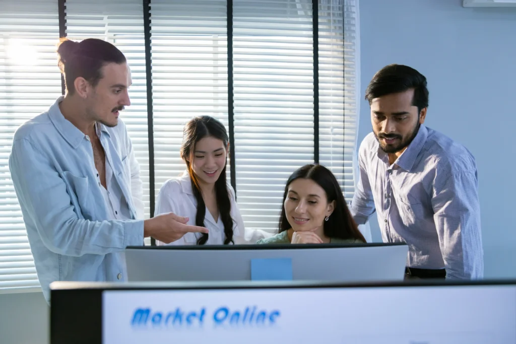 Young creative marketing team discussing online campaign planning for a digital marketing company website.