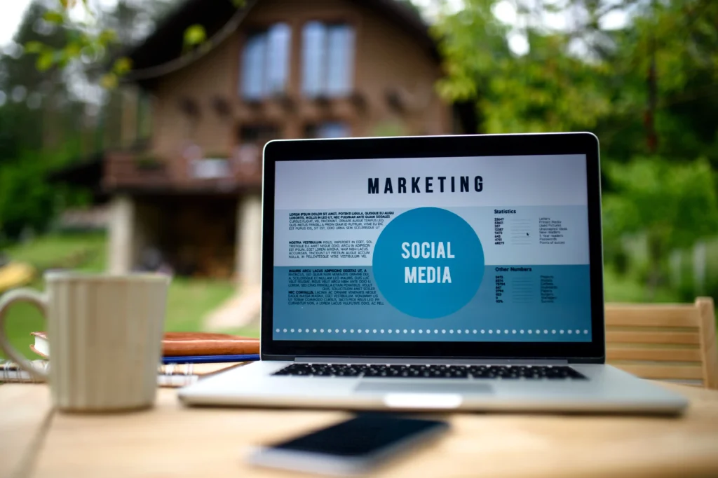 Laptop displaying a social media marketing screen outdoors, symbolizing professional digital marketing services focused on content planning, analytics, and audience engagement.