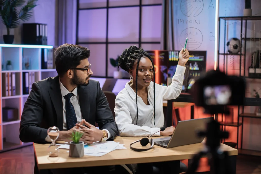 Professionals planning marketing strategy and video content in a modern office for a content production agency.
