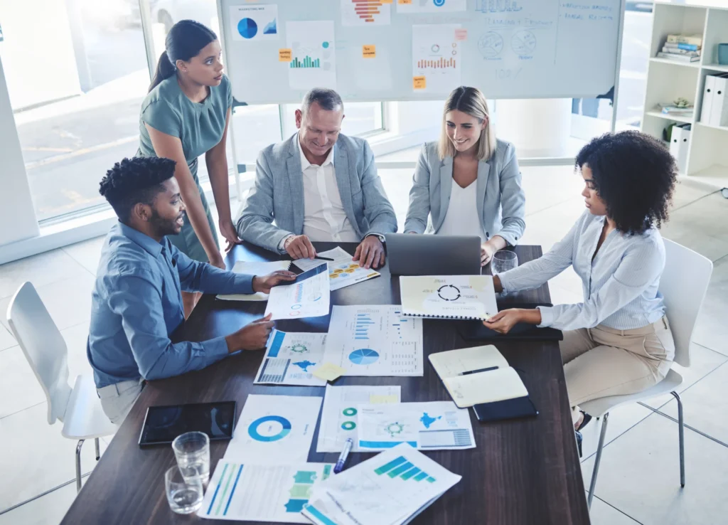 Business executives reviewing charts and analytics for an enterprise local SEO campaign.