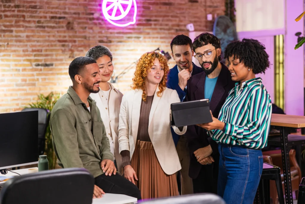 Creative marketing professionals reviewing analytics and planning online reputation management in digital marketing campaign.