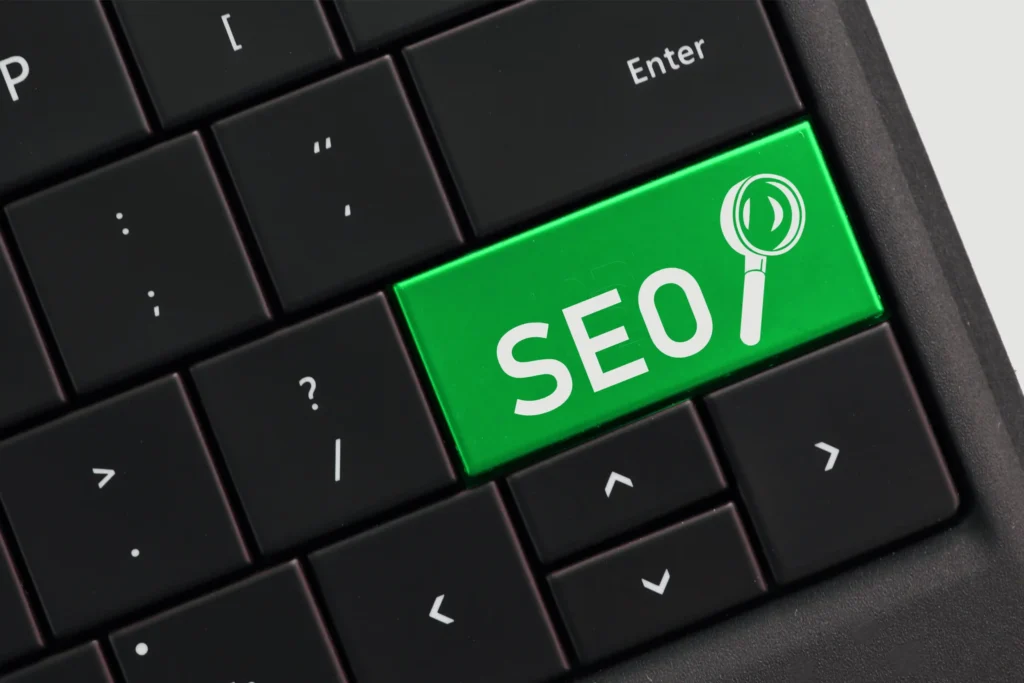 Keyboard close-up with a green SEO key symbolizing digital marketing and local seo company services.