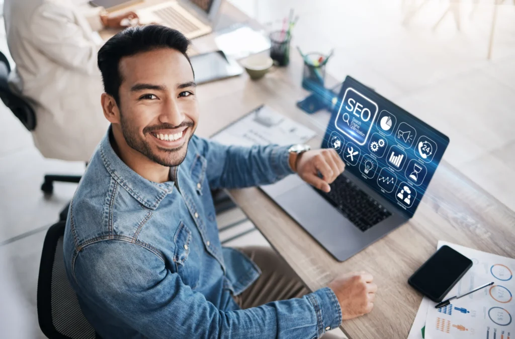 Smiling marketer using SEO analytics software to optimize digital marketing solutions for small businesses.