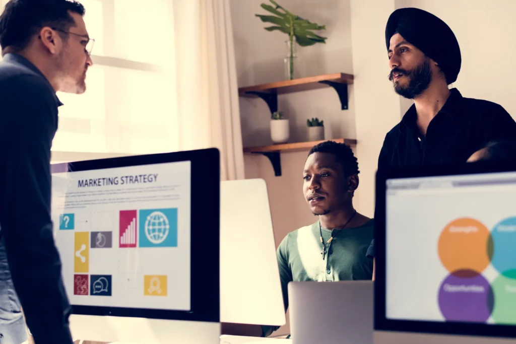 Creative team planning strategy in a modern office, representing collaboration and design elements found in the best marketing agency websites.