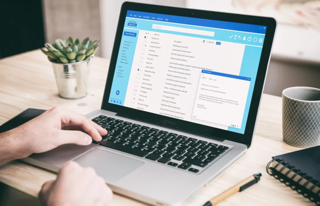 User managing email messages on a laptop screen, highlighting tools used in email marketing for restaurants.