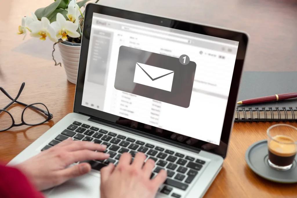 Email notification appearing on a laptop as a user types, symbolizing guest engagement in email marketing for restaurants.
