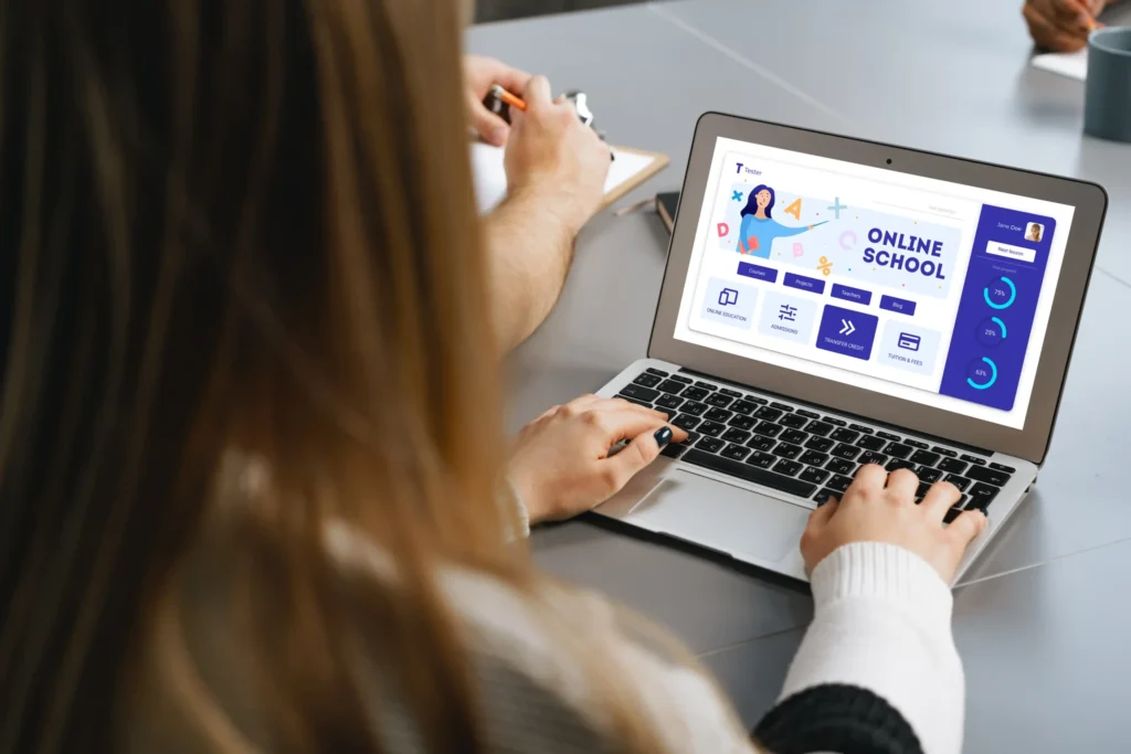 Person browsing an online school interface on a laptop, showcasing clean UI layouts commonly seen in the best digital agency websites.