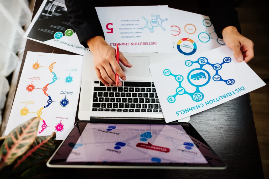 Marketer reviewing charts and distribution channels as part of a digital marketing services list performance analysis