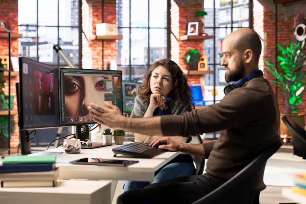 Digital creative agency professionals reviewing visual design and creative assets during a collaborative branding session