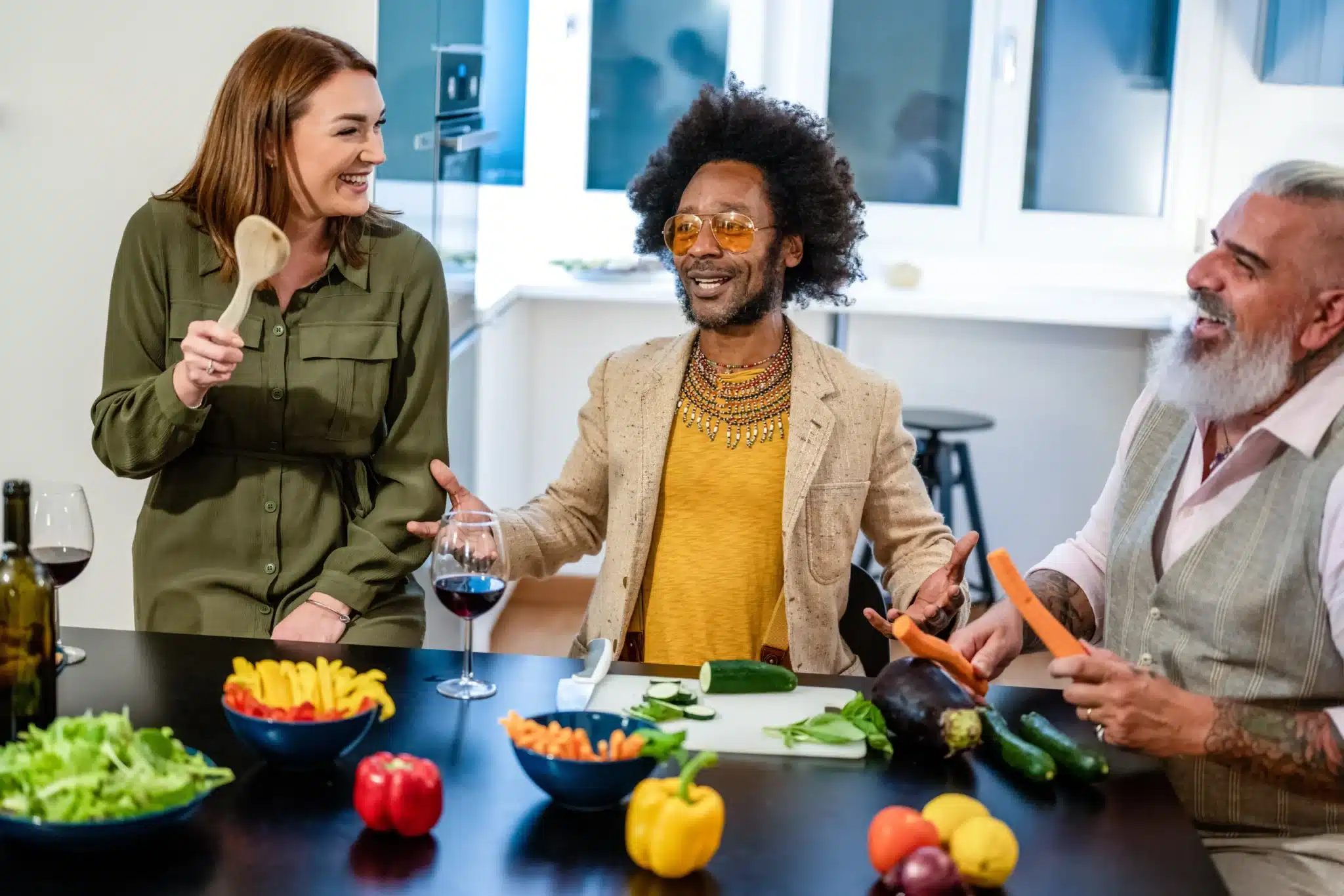 Group of friends cooking and enjoying a meal, representing community and lifestyle concepts for food marketing ideas and social campaigns.